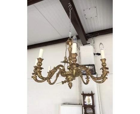 A reproduction brass three-branch ceiling light