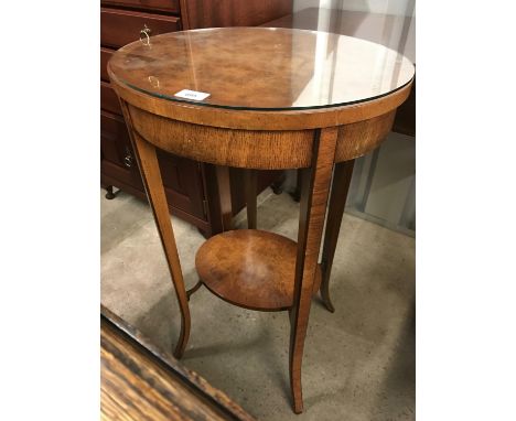 A burr walnut veneered oval lamp table