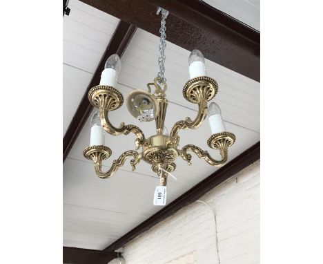 A small brass five-branch ceiling light