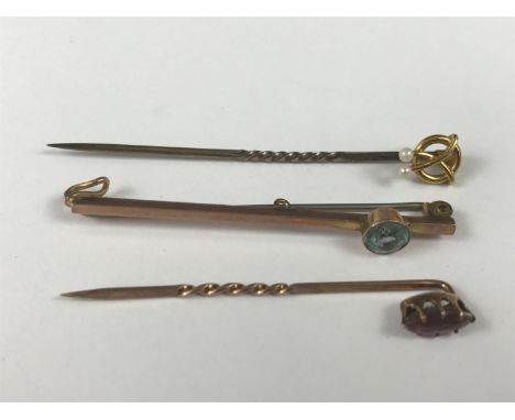 A yellow metal and pearl stick pin, stamped 15ct, together with a yellow-metal and aquamarine bar brooch, stamped 9ct, and on