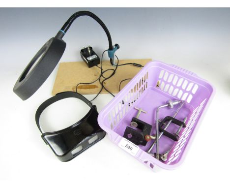 Carl Zeiss magnifying glasses, fly tying vices together with a stonefly magnifying lamp