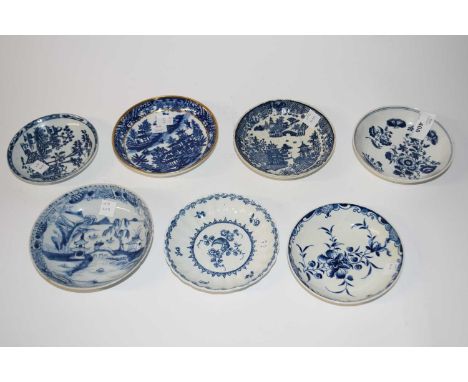 A collection of 18th Century English porcelain saucers with blue and white designs, mainly Worcester and Chinese examples