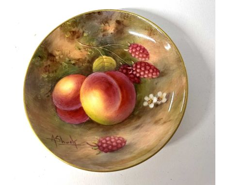 A Royal Worcester pin tray painted with fruit, signed by Shuck, 9cm diameter