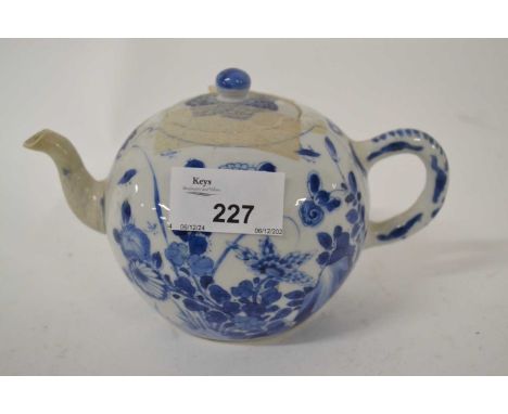 18th century Chinese porcelain tea pot with blue and white design of flowering plants, probably Kangxi (spout restored)