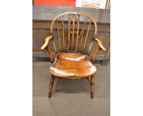 A contemporary stick back armchair with elm seat, turned legs and an H formed stretcher, marked to the under side of the seat