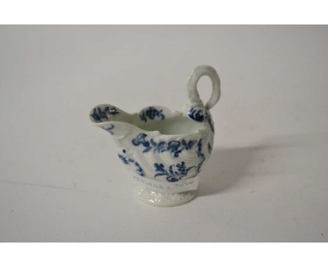 An 18th Century Worcester dolphin shaped ewer with blue and white design