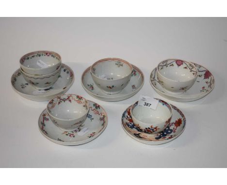 A group of English porcelain tea bowls and saucers, mainly Newhall with floral designs together with a Lowestoft porcelain te