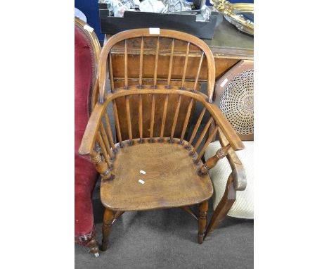 An elm seated Windsor chair with stick back, turned legs and crinoline stretcher, 92cm high