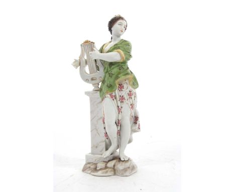 A continental porcelain figure of a classical lady with harp, 21cm high