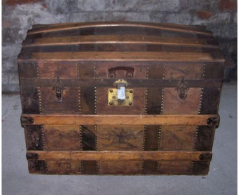 A metal and wooden banded dome top Trunk, the interior fitted with a fall front compartment and a glove box, 2' 6" (76cms) wi
