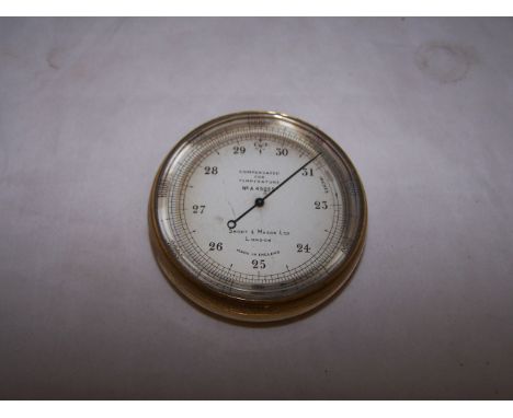 A Pocket Barometer by Short & Mason, no. A45855, in brass case, 2 1/2" (6.5cms) diameter.