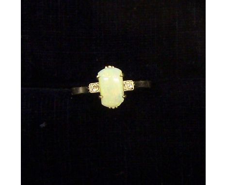 An opal and diamond three stone Ring marked '9ct.' (chip to opal).