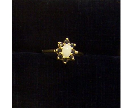 A 9ct gold opal and sapphire Cluster Ring.