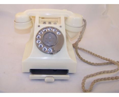 Another vintage Telephone in ivory Bakelite case with three chrome buttons and dial with index drawer.