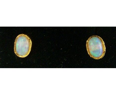 A pair of silver gilt oval opal Earrings.