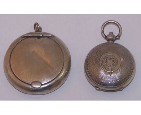 A silver circular Sovereign Case with engine turned decoration, Birmingham 1910, and a small silver Powder Compact.