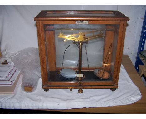 A set of Oertling Chemical Balance Scales in glazed case.