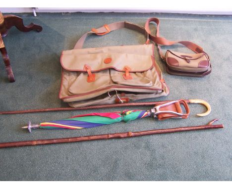 A leather mounted Canvas Shooting Bag, a shooting stick, thumb stick and other items.