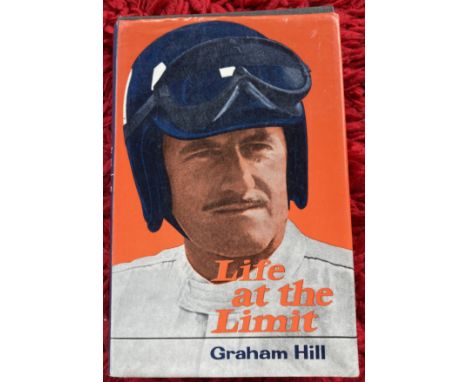 Formula One Graham Hill signed hardback book Life at the Limit. Large blue ink autograph on title page. Good Condition. All a