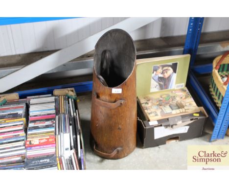 A coal scuttle and tools