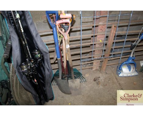 A quantity of long handle gardening tools