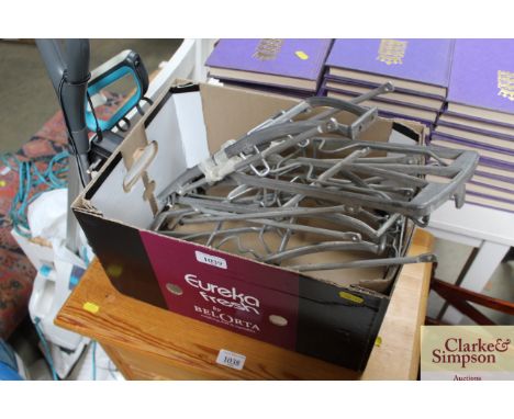A box containing vintage back racks