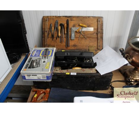 A large wooden tool box containing three planes, a range of wood chisels, hand saws, many small hand tools, a cordless power 