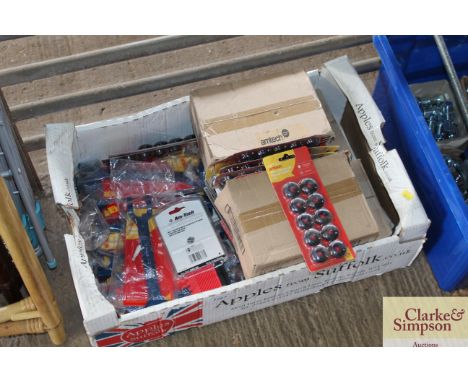 A box containing tarpaulin repair eyelets; Amtex basin wrenches; Amtex wall tile adhesive, adhesive applicator etc