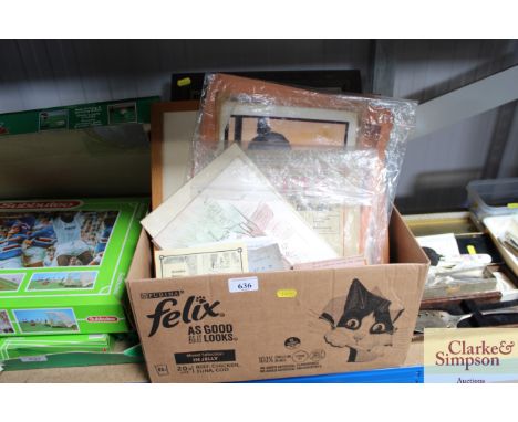 A box containing various pictures and prints 