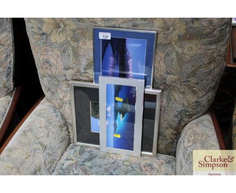 Three framed photographic prints of mountainous landscapes