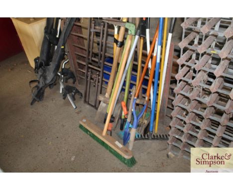 A quantity of long handle gardening tools