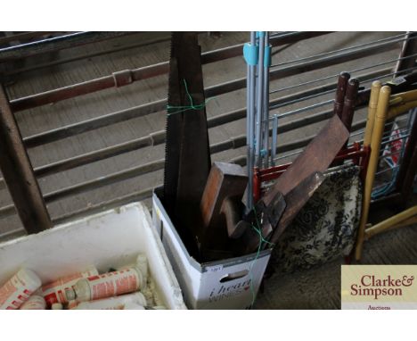 A box of various hand tools to include saws; wood working plane etc