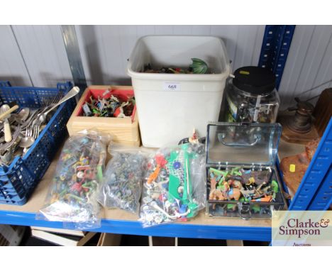 A quantity of various children's figures to include Subbuteo, horses, action figures etc.