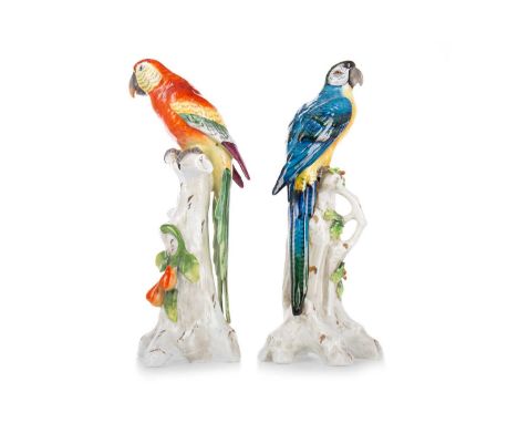 CAPODIMONTE, PAIR OF PORCELAIN PARROTS, 19TH CENTURY finely decorated in polychrome enamels, modelled perched on trunk column