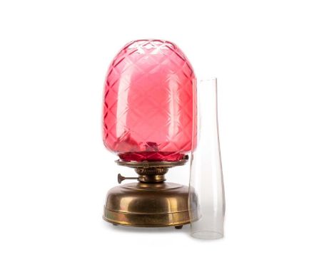 VICTORIAN OIL LAMP, with clear glass chimney and moulded cranberry glass shade, brass burner45cm high