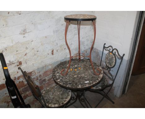 A GARDEN TABLE AND TWO CHAIRS