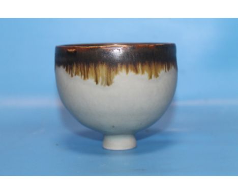 A LUCIE RIE SMALL MANGANESE FOOTED BOWLThere is a glazed firing crack / flaw to the rim, and inside the footrim to the base. 