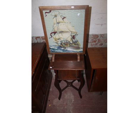 A TAPESTRY FIRE SCREEN DEPICTING A SHIP TOGETHER WITH A COFFEE TABLE