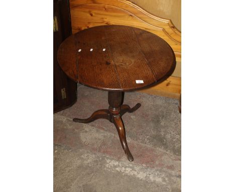 A OAK TILT TOP TRIPOD TABLE