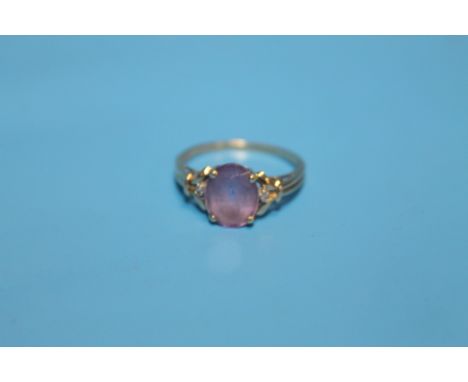 A 9 CT GOLD RING SET WITH AMETHYST