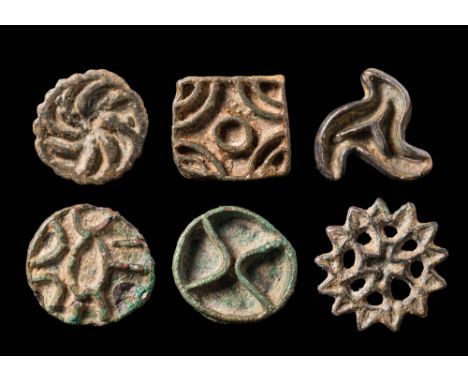 Ca. 2300 - 2000 BCA set of six bronze openwork stamp seals of various shapes. The first seal is round with a protruding spira