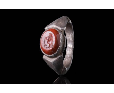 Ca. AD 100 - 300A Roman silver ring with a triangular sectioned band that widens on the shoulders to form an oval bezel, whic