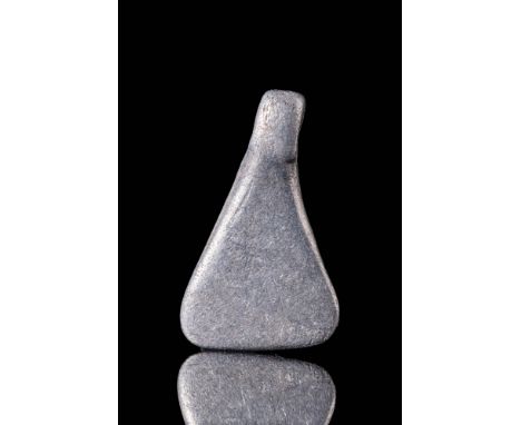 Ca. AD 800 - 1100A Viking silver axe head pendant in a petite, triangular form with a crescent-shaped blade edge, a tapered n