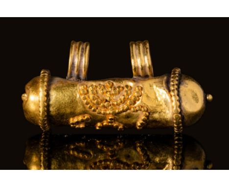Ca. AD 100 - 200A Romano-Jewish gold bulla pendant with filigree decoration depicting a Menorah on the central tubular part o