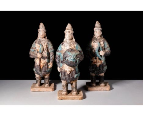 Ca. AD 1368 - 1644A group of three terracotta soldiers. The soliders are shown to be wearing the same armor, with a conical h