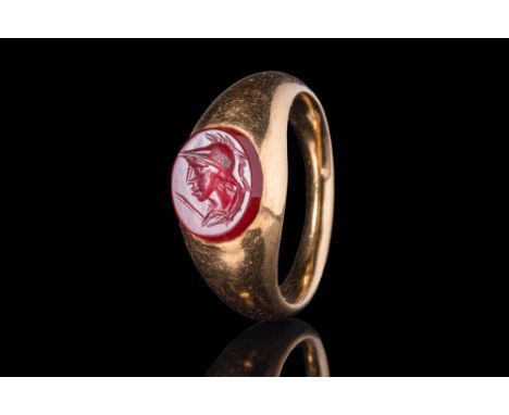 Ca. AD 100 - 300A Roman round carnelian intaglio depicting the busto of the goddess Minerva facing left and dressed in her ch