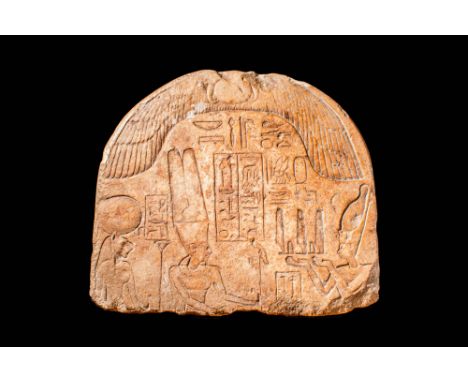 Ptolemaic Period / Early Roman Period, Ca. 300 BC - AD 100 An Egyptian offering stele. Underneath an arching winged sun disk,