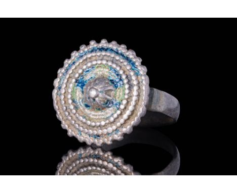 Ca. AD 500 - 700A Byzantine silver ring with a large crown shaped bezel. The ring features a band with a flattened interior t