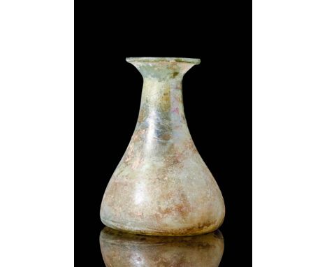 Ca. AD 100 - 300A Roman pale green glass unguentarium displaying a pear shaped body, a short, tapering neck, and a flared fol