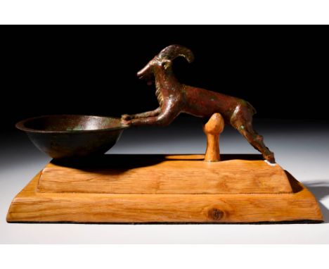 Ca. 2000 - 1000 BCA Large Amlash bronze spoon with a stag shaped handle. A solid, cast bronze stag, standing upon two hooved 